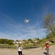 Lincoln University journalism students observe as assistant professor Will Sites, left, pilots a DJI Phantom 3 drone. (Kelsey Bias)